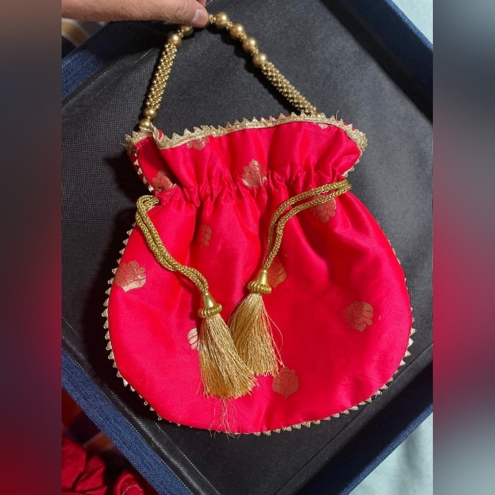 Women's pink and gold potli handbag for party or wedding